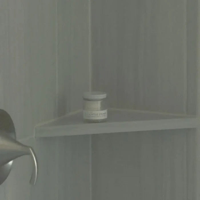 Small jar on a shelf in a bathroom setting