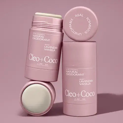 Cleo+Coco natural deodorant sticks on a pink background