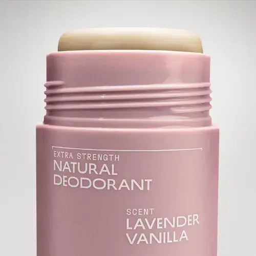 Pink deodorant stick with 'Extra Strength Natural Deodorant' and 'Lavender Vanilla' scent on a light gray background