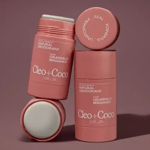Cleo+Coco natural deodorant sticks on a brown background