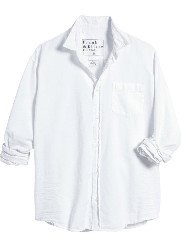 The FRANK & EILEEN LUKE Men's Button Up Shirt in Famous Denim White features long roll-up sleeves, a chest pocket, and a collar. The label reads "Frank & Eileen EST 1947." Displayed on a white background.