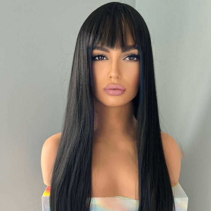 Black wig with bangs on a mannequin head against a gray background