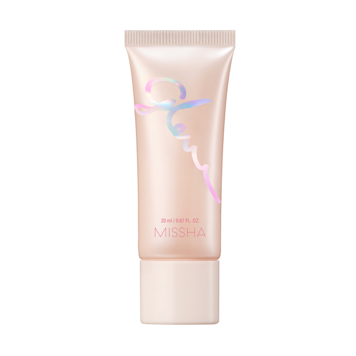 A closed container of Missha Glow Skin Balm with a pink and silver color scheme.