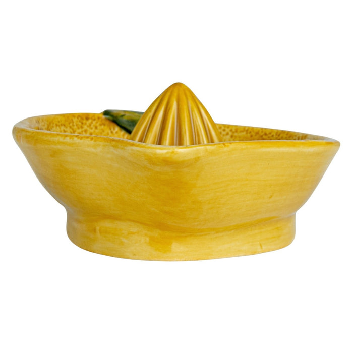 The CREATIVE COOP HAND-PAINTED STONEWARE LEMON SHAPED JUICER features a textured yellow finish, brown stem, and green leaf—ideal as a rustic squeezer and farmhouse kitchen decor. Shown in top and side views.