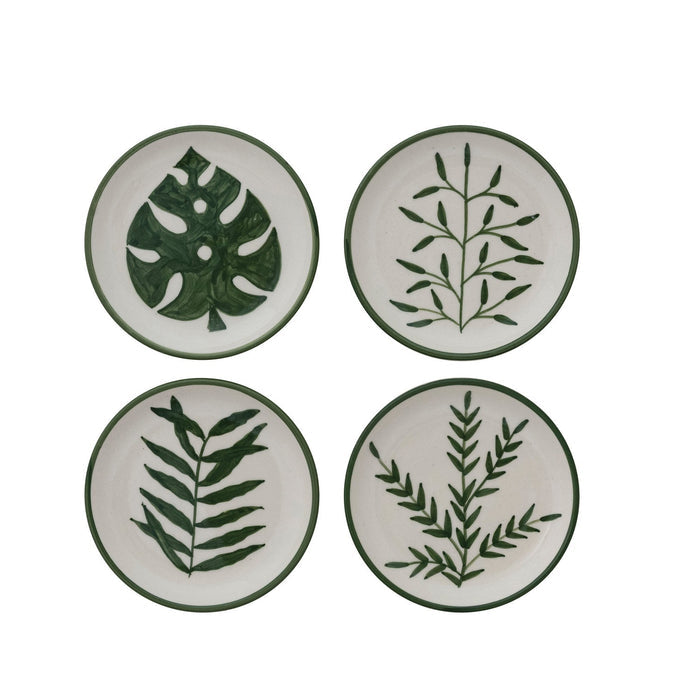 Set of four CREATIVE COOP HAND-PAINTED STONEWARE PLATES, each with a unique botanical design and green rim. Delicate green leaf patterns make every appetizer plate an artful addition to your table.