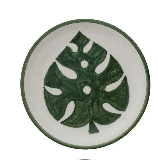 Set of four CREATIVE COOP HAND-PAINTED STONEWARE PLATES, each with a unique botanical design and green rim. Delicate green leaf patterns make every appetizer plate an artful addition to your table.