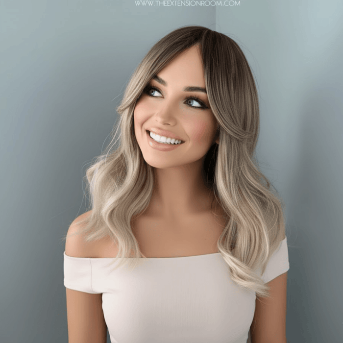 Harlow Rooted Ash Light Brown Wig with Bangs showcasing beachy waves and soft curtain bangs.