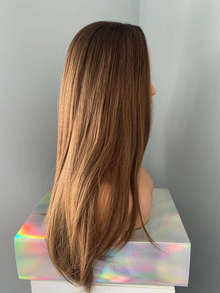 Holly Silky Straight Brown Wig shown from the side, featuring ultra-long length and a glossy finish.
