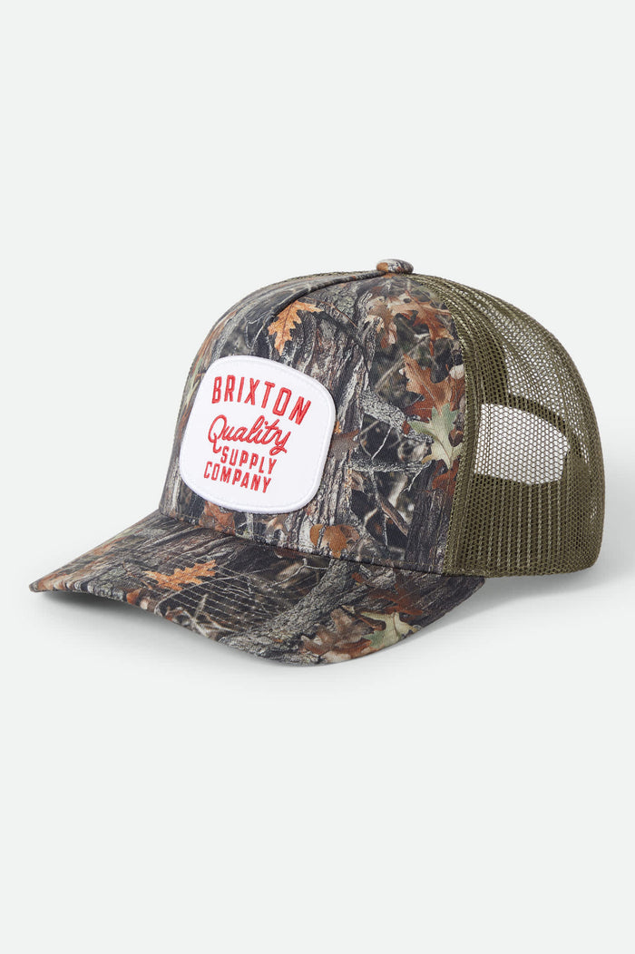 Unisex Hubal Netplus Trucker Hat in the color Tree Camo/Olive - Front Product View