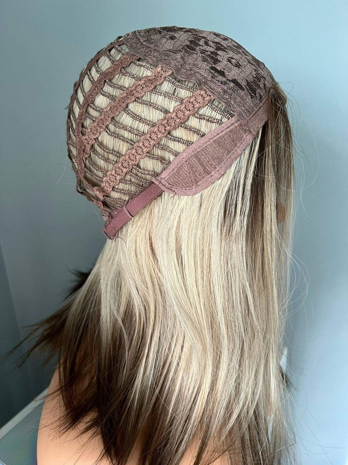 Interior view of the Jenna Short Rooted Blonde Wig with Low Lites cap construction showing breathable mesh and adjustable straps.