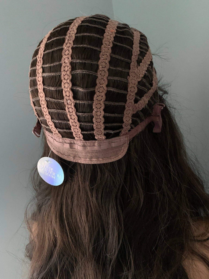 Dark Brown Wig cap design showing internal structure and adjustable straps for comfort.