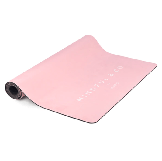 Pink yoga mat with 'MINDFUL & CO' branding on a white background