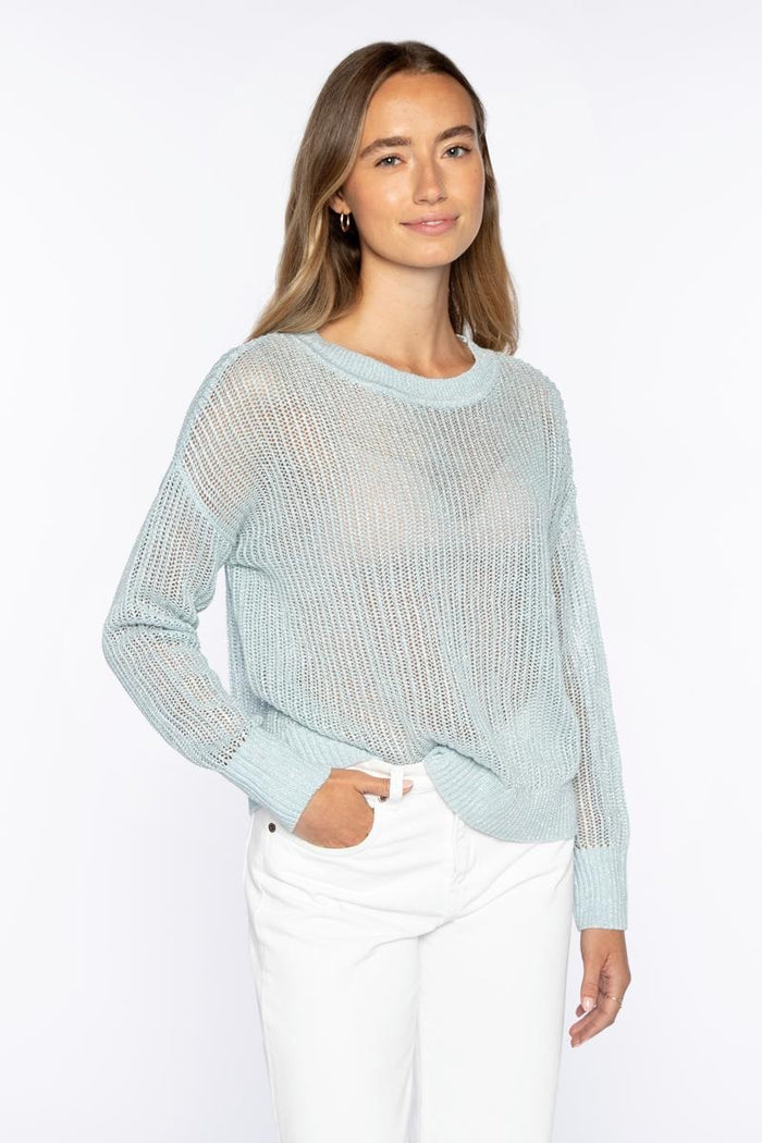 The KINROSS CASHMERE Open Texture Lurex Crew Neck Linen Sweater by KINROSS features light beige ribbed knit, long sleeves, dropped shoulders, relaxed fit, and openwork stitch design—shown against a plain white background.