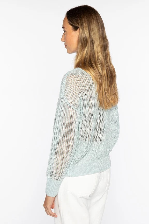 The KINROSS CASHMERE Open Texture Lurex Crew Neck Linen Sweater by KINROSS features light beige ribbed knit, long sleeves, dropped shoulders, relaxed fit, and openwork stitch design—shown against a plain white background.