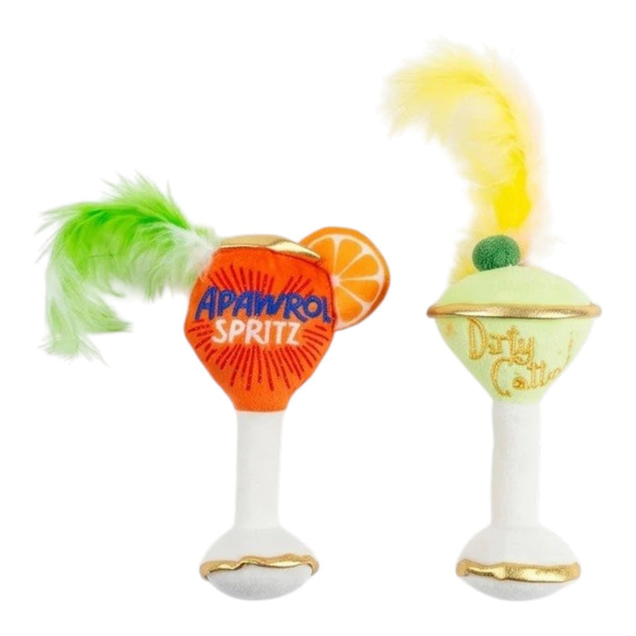 Delight and entertain your feline friend with the KITTY COCKTAILS ORGANIC CATNIP TOYS by HAUTE DIGGITY DOG—this playful set features two plush cat toys shaped like cocktails: one orange with a green feather, labeled "Apawrol Spritz," and one pale green with a yellow feather, labeled "Dirty Catini." Both toys have white stems, gold accents, and are crafted from organic catnip for irresistible feline fun.