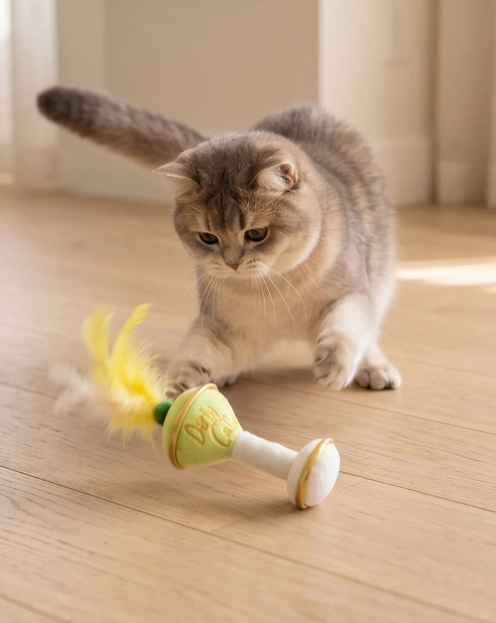 Delight and entertain your feline friend with the KITTY COCKTAILS ORGANIC CATNIP TOYS by HAUTE DIGGITY DOG—this playful set features two plush cat toys shaped like cocktails: one orange with a green feather, labeled "Apawrol Spritz," and one pale green with a yellow feather, labeled "Dirty Catini." Both toys have white stems, gold accents, and are crafted from organic catnip for irresistible feline fun.