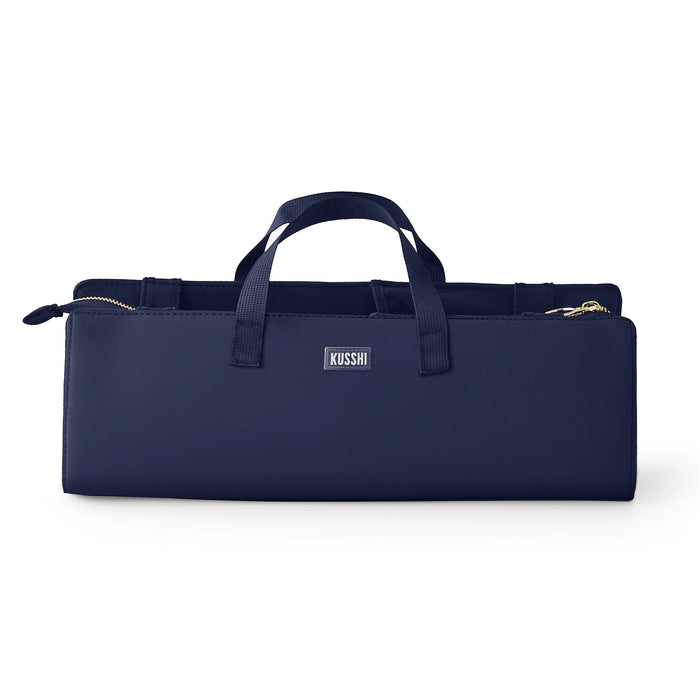The KUSSHI - Hair Tools Travel Bag in Navy is a rectangular, heat-resistant case with zipper closure, small carrying handles, and the KUSSHI label on the front.
