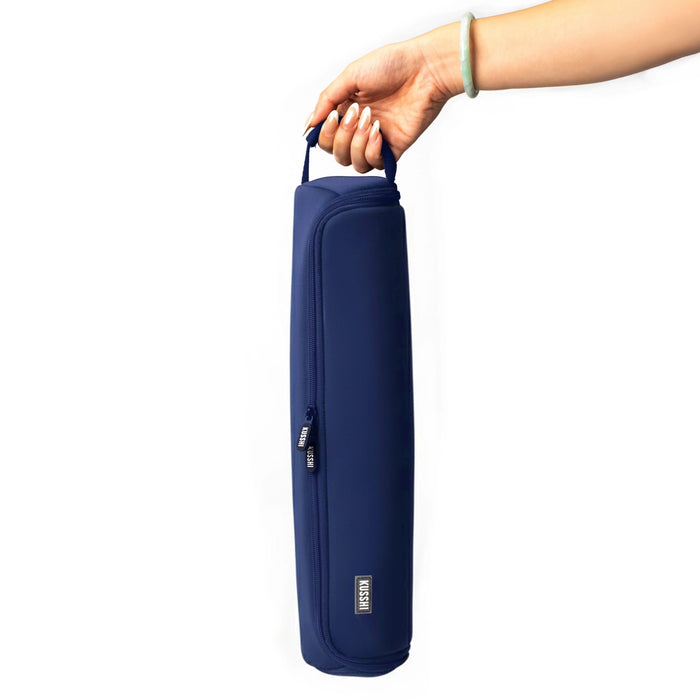 The KUSSHI Hair Tools Travel Case in navy is a cylindrical pouch with a top zipper and a small end handle. It features the KUSSHI brand label near the zipper and is machine washable for easy care.
