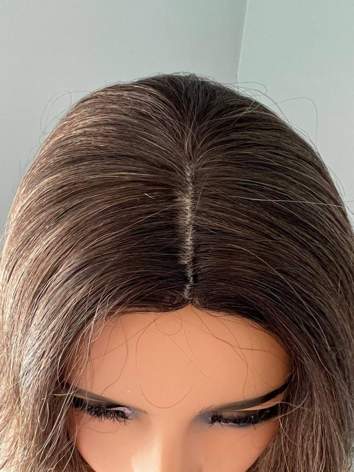Top view of the Kylie Long Brown Curled Wig, showcasing its natural-looking hair part and soft brown curls.