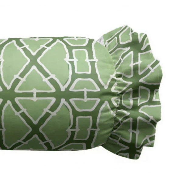 The LOOM AND CLOTH - LATTICE RUFFLED BOLSTER PILLOW IN GREEN by LOOM & CLOTH features a green cylindrical shape with a white geometric lattice pattern and charming ruffled ends. Crafted from soft cotton, this vintage-chic pillow design is shown isolated on a white background.