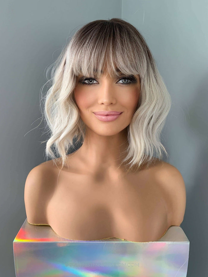 Lucy Short Bob Wig with Bangs showcasing soft waves and full bangs for a trendy look. Perfect Short Bob Wig hairstyle.
