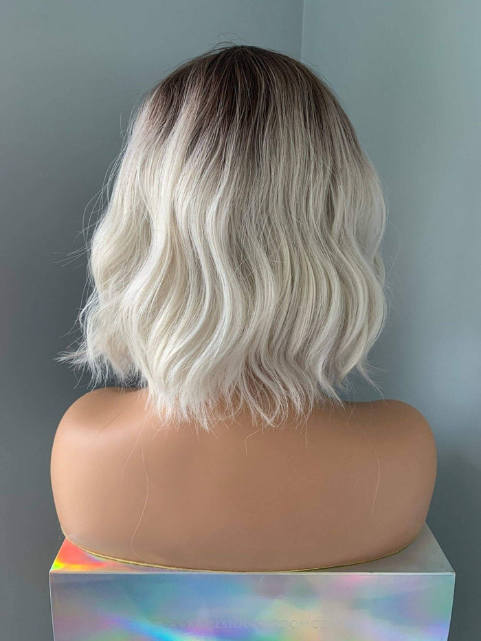 Back view of Lucy Short Bob Wig with Bangs, featuring soft waves and a trendy ombre style.