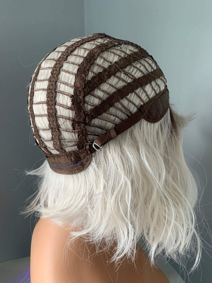 Back view of a Short Bob Wig cap demonstrating its interior structure and adjustable features.
