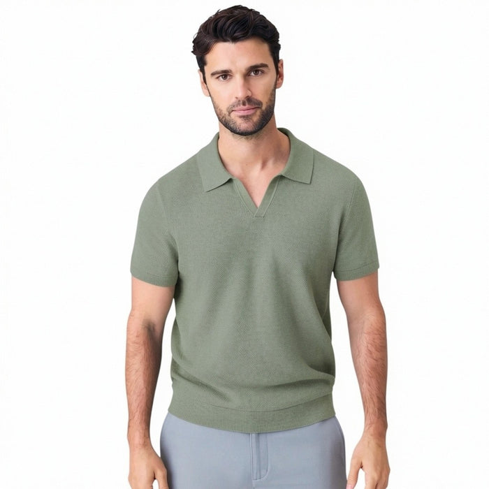 A man with short dark hair is seen from behind wearing the MACK WELDON Tech Linen Johnny Collar Polo Sweater in Sage Leaf Heather, paired with light gray pants against a plain light gray background.