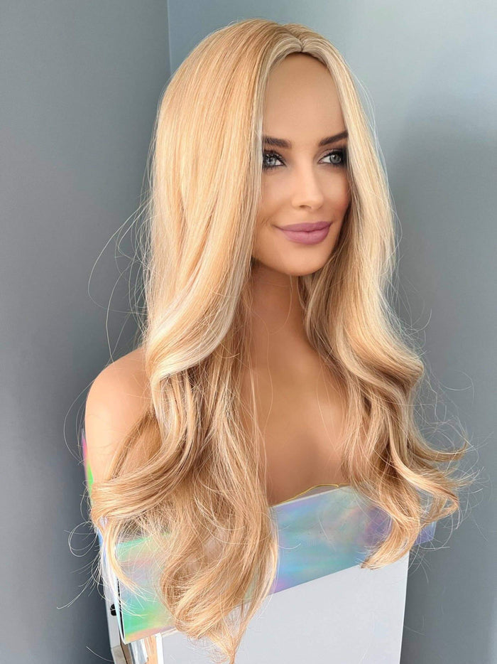 Madelyn Long Golden Blonde Curled Wig featuring loose, flowing curls and soft layers for natural volume.