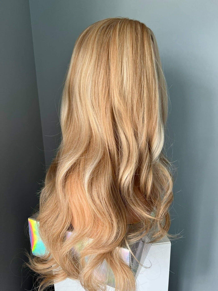 Back view of the Madelyn Long Golden Blonde Curled Wig showcasing soft layers and flowing curls.
