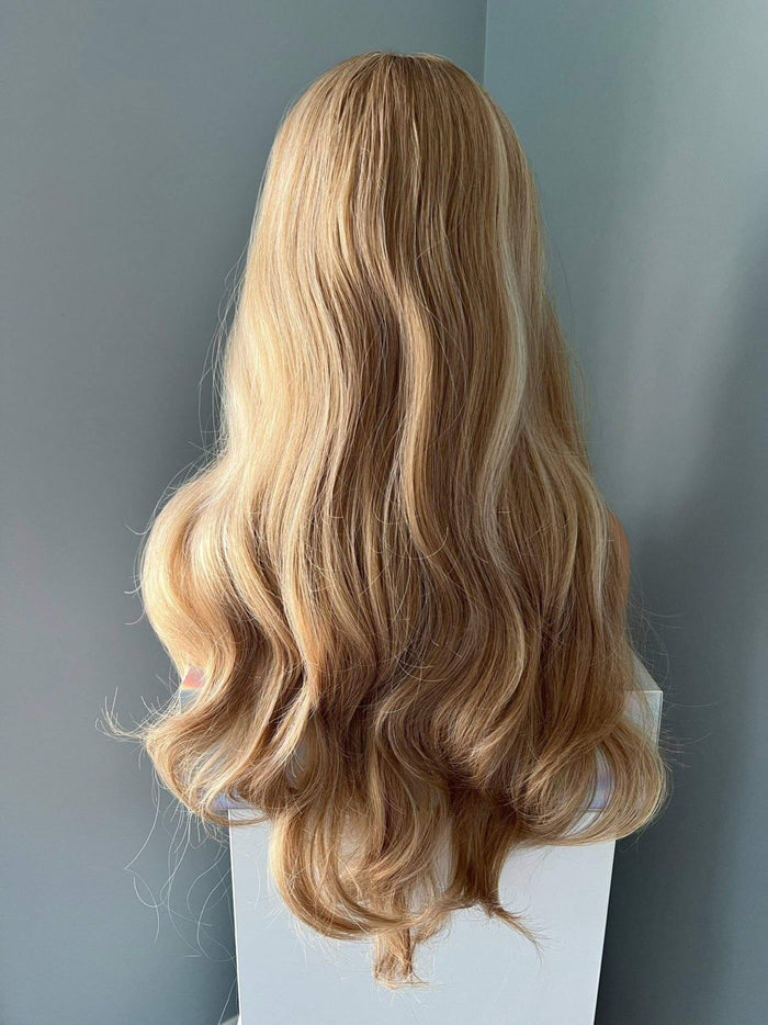 Madelyn Long Golden Blonde Curled Wig showcasing soft, flowing curls and layers for a romantic look.