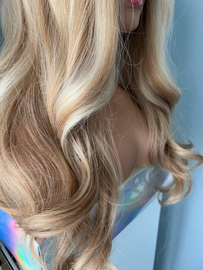 Close-up of the Madelyn Long Golden Blonde Curled Wig, showcasing beautiful flowing curls and volume.