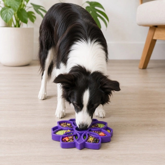 The MANDALA ETRAY Slow Feeder Enrichment Dog Bowl by SODA PUP is a pink silicone tray shaped like a flower with eight petal-like compartments and a subtle central logo, making it an ideal shallow slow feeder and enrichment tray for interactive mealtime fun for dogs.