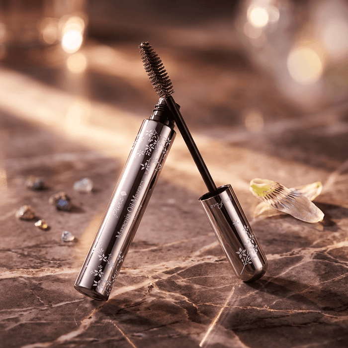 Mascara with decorative packaging on a marble surface