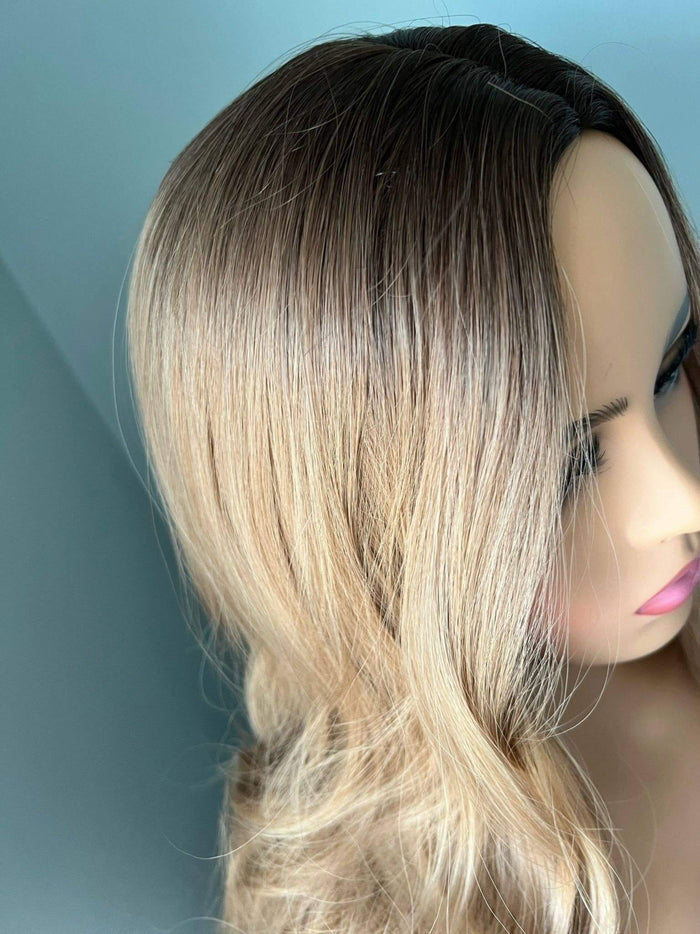 Close-up of the Margot Long Honey Blonde Curled Wig showcasing soft, blended honey blonde and dark roots. Curled Wig.
