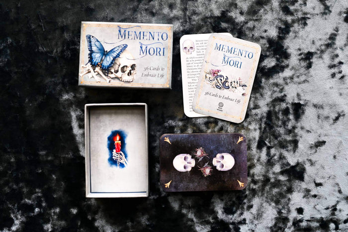 Memento Mori Cards featuring beautifully designed affirmation cards with skulls and butterfly on a dark velvet background.
