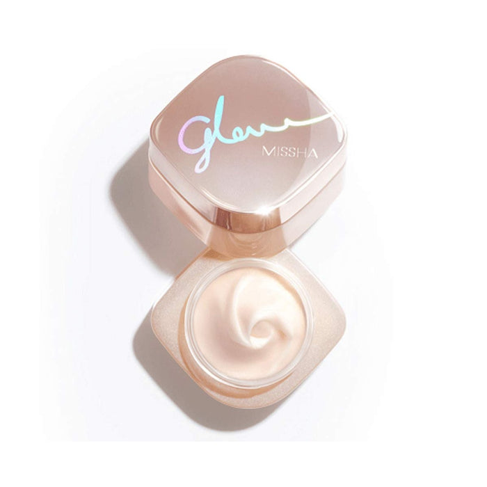MISSHA Glow Skin Balm is a multi-functional 4-in-1 formula that works as a moisturizer, primer, glow cream, and morning pack to enhance your skin’s natural radiance. Infused with Rosa Damascena Flower Water, Niacinamide, and Squalane, it hydrates, brightens, and smooths the skin. Shea Butter, Macadamia Seed Oil, and Jojoba Oil provide deep nourishment, while Ceramide NP and Sodium Hyaluronate help strengthen the skin barrier and maintain moisture. The lightweight texture leaves skin glowing, sof