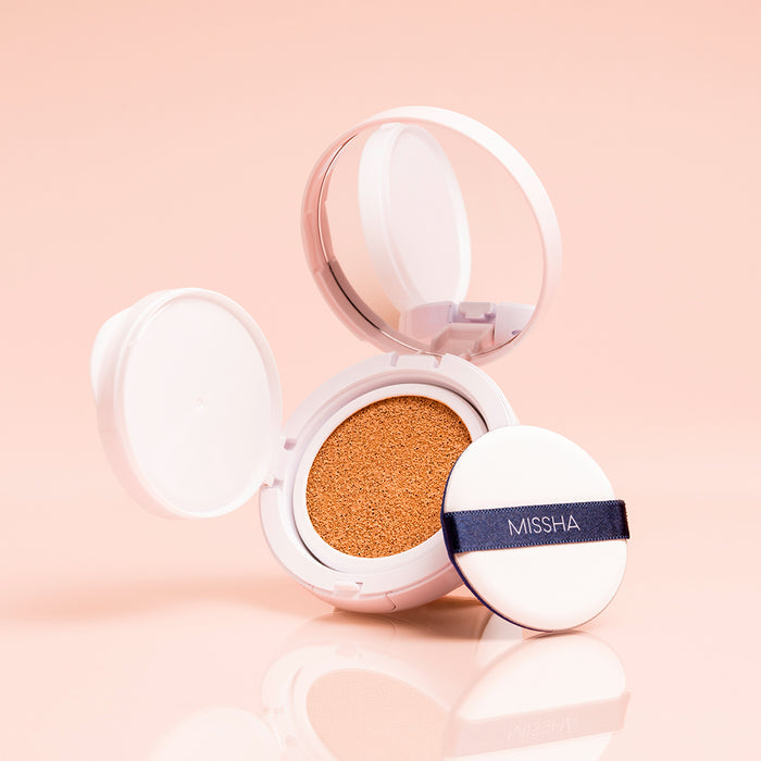 Missha cosmetic compact with a white lid and beige cushion on a stylized background 27