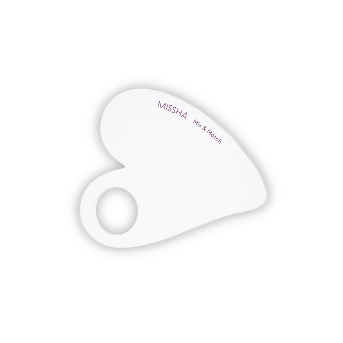 A clear, heart-shaped makeup palette with the brand name MISSHA written on it.