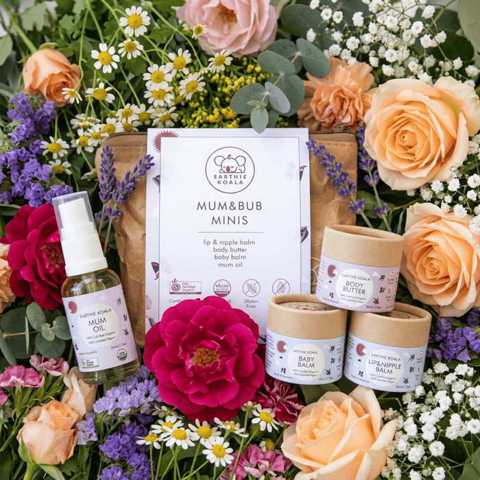 Mum and Bub Minis - Earthie Koala skincare set with organic products for mum and baby in floral arrangement.