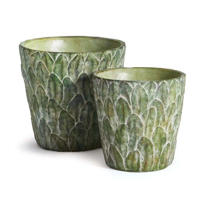 The NAPA HOME AND GARDEN - FELDBURG POT, SMALL features a green ceramic finish with a textured surface that resembles overlapping leaves or scales for an artichoke-like look. The plant pot is shown against a plain white background.