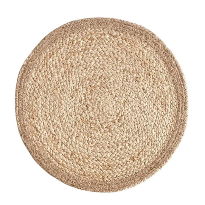 The NAPA HOME AND GARDEN - JUTE COIL ROUND PLACEMAT features a braided jute texture and natural beige color, resembling a hand-woven placemat, shown against a white background.