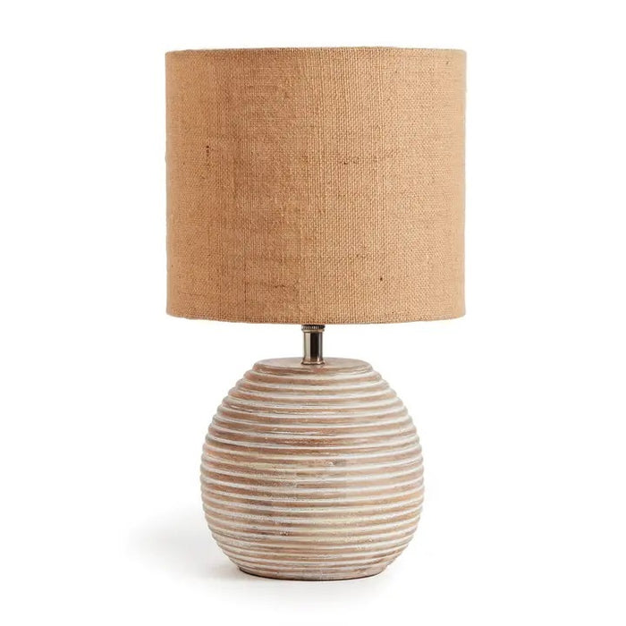 The NAPA HOME AND GARDEN - MADDIE TABLE LAMP features a round, ribbed ceramic base in light beige and a textured brown natural linen shade, adding simple modern style to any room.