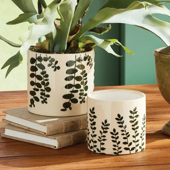 The NAPA HOME AND GARDEN Maren Pot, Small, features embossed leafy designs on white ceramic—a perfect orchid vessel to pair with its larger counterpart for a coordinated display.