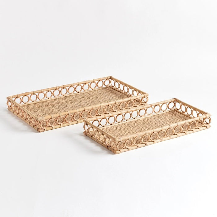 The NAPA HOME AND GARDEN Ninette Rectangular Rattan Tray, Large, features raised sides and a decorative open circle edge in natural beige—ideal for bringing boho coastal charm to your home decor.