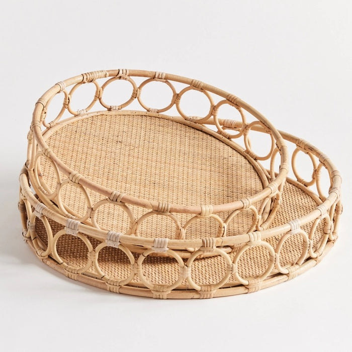 The NAPA HOME AND GARDEN Ninette Round Rattan Tray, Large, features a woven base and open circular sides—an ideal boho accent for lovers of natural rattan decor.