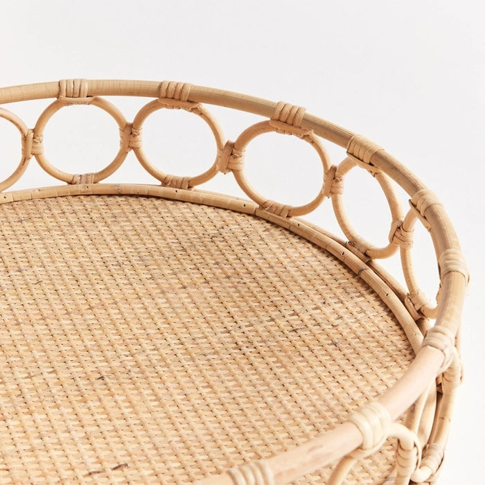 The NAPA HOME AND GARDEN Ninette Round Rattan Tray, Large, features a woven base and open circular sides—an ideal boho accent for lovers of natural rattan decor.