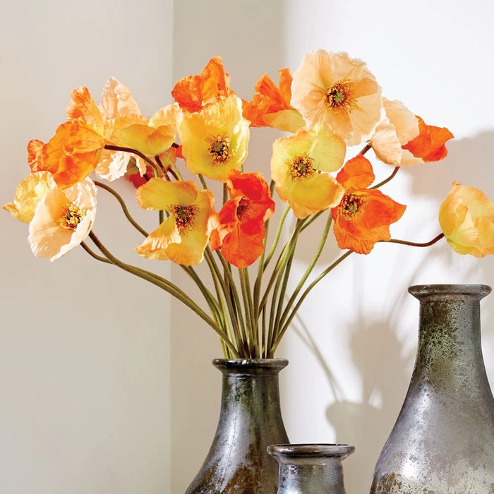 The NAPA HOME AND GARDEN - ORANGE POPPY STEMS feature three lifelike orange and yellow poppy flowers with realistic stems, tied together—ideal artificial blooms from NAPA HOME AND GARDEN to enhance your elegant home decor.