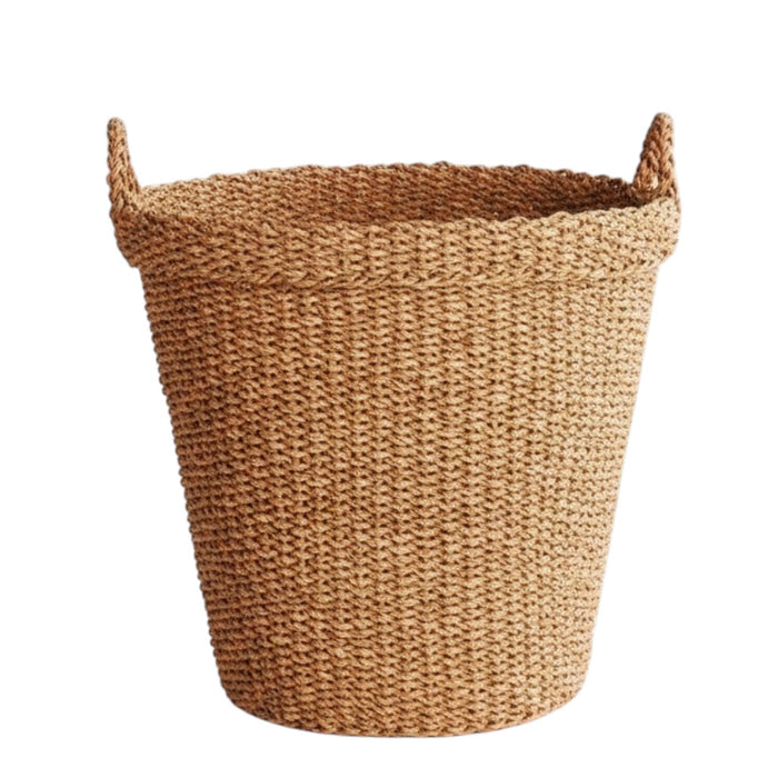 The NAPA HOME AND GARDEN Seagrass Tapered Basket with Handles and Cuff, Large, is shown from above, highlighting its natural seagrass texture and expert craftsmanship on a matching surface.