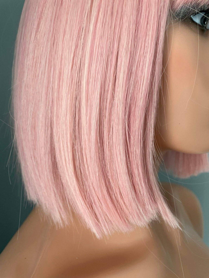 Nia Short Baby Pink Bob Wig showcasing soft pastel pink tones and blunt-cut style.